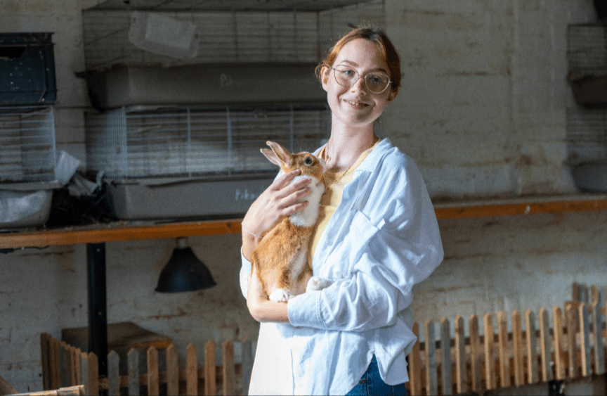 Hayley holds a rabbit at the Countryside Education Trust during the New Forest Youth Board launch weekend